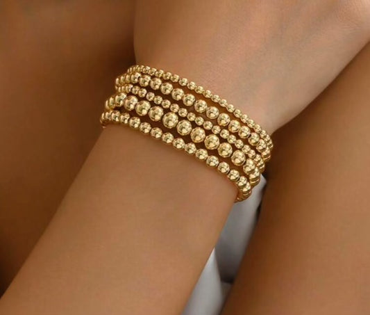 Set of 5 golden bracelets